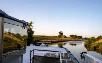 Window reflection on bridge of boutique river cruise ship MS Thurgau Saxonia (Thurgau Travel) on Alte Oder river, Bad Freienwalde Hohensaaten, Brandenburg, Germany
