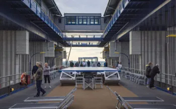 Passengers on sun deck of boutique river cruise ship MS Thurgau Saxonia (Thurgau Travel) inside Schiffshebewerk Niederfinow boat lift, Niederfinow, Brandenburg, Germany