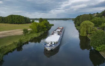 Aerial of boutique river cruise ship MS Thurgau Saxonia (Thurgau Travel) on Alte Oder river, Oderberg, Brandenburg, Germany