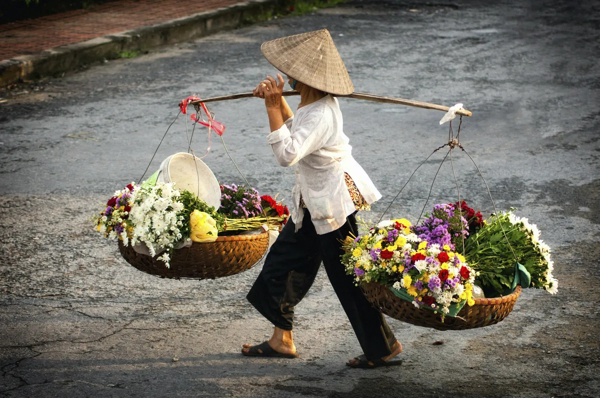 Blumenverkäuferin Hanoi