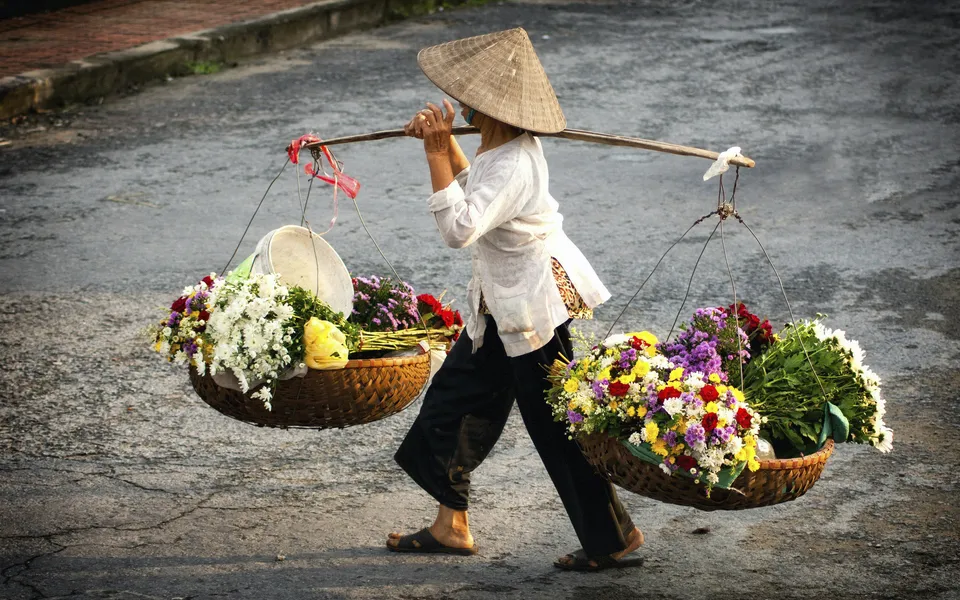 Blumenverkäuferin Hanoi